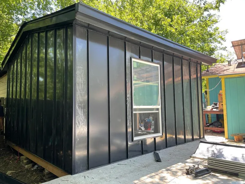 Black standing seam metal wall panels for Roof Inspection in Olivarez